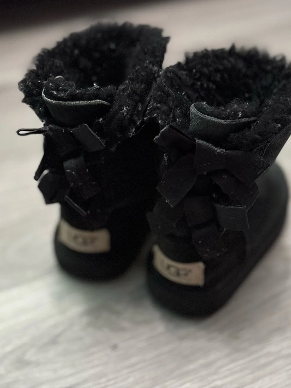 UGG Kids Black Suede Shearling Bow Boots Size 7